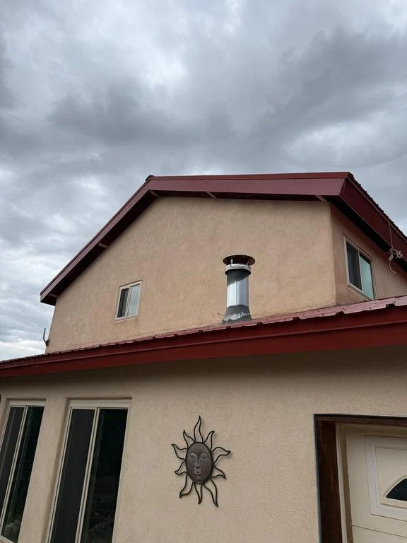 Second-story gable with new red metal fascia