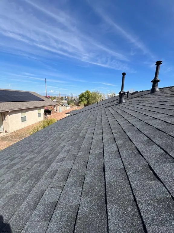 New black pipe vents on the finished charcoal shingle roof