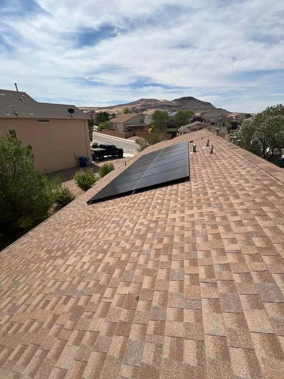 Weathered tan shingle roof before replacement