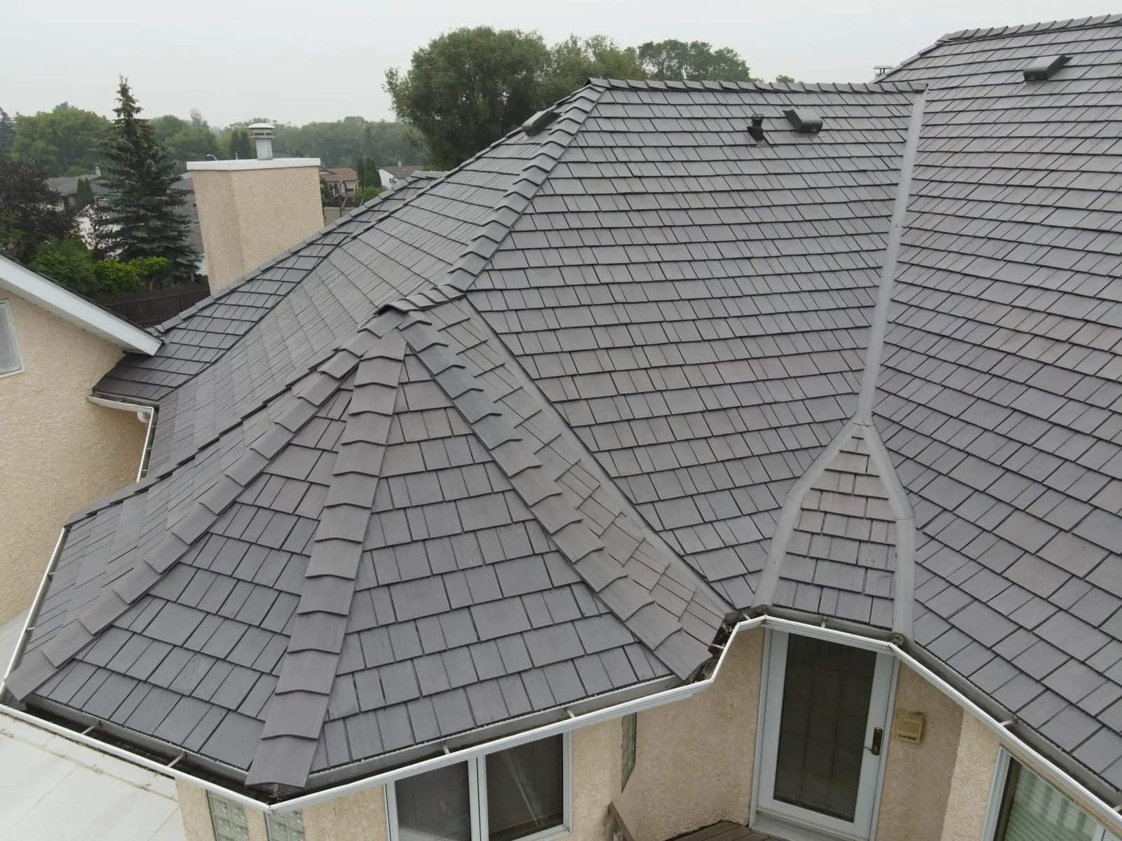 Aerial view of an Enviroshake composite shake roof on a large home
