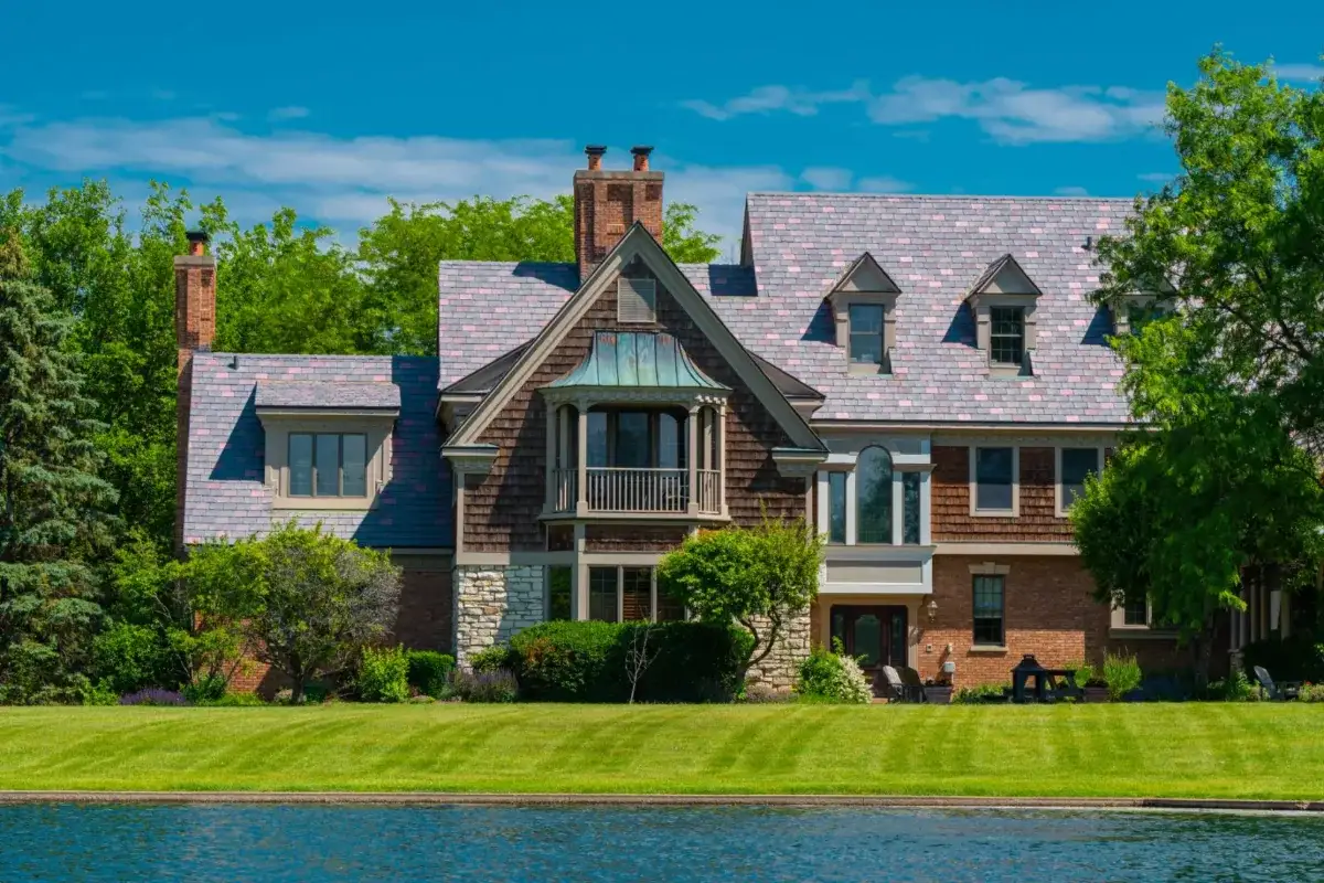 Tudor-style brick home with an Enviroslate Multi-Tone roof