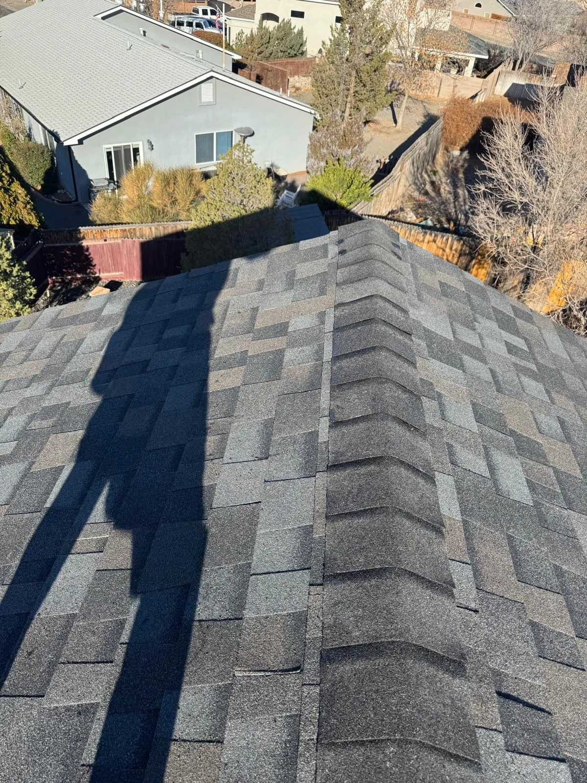 Asphalt shingle roof and house exterior on an Albuquerque home