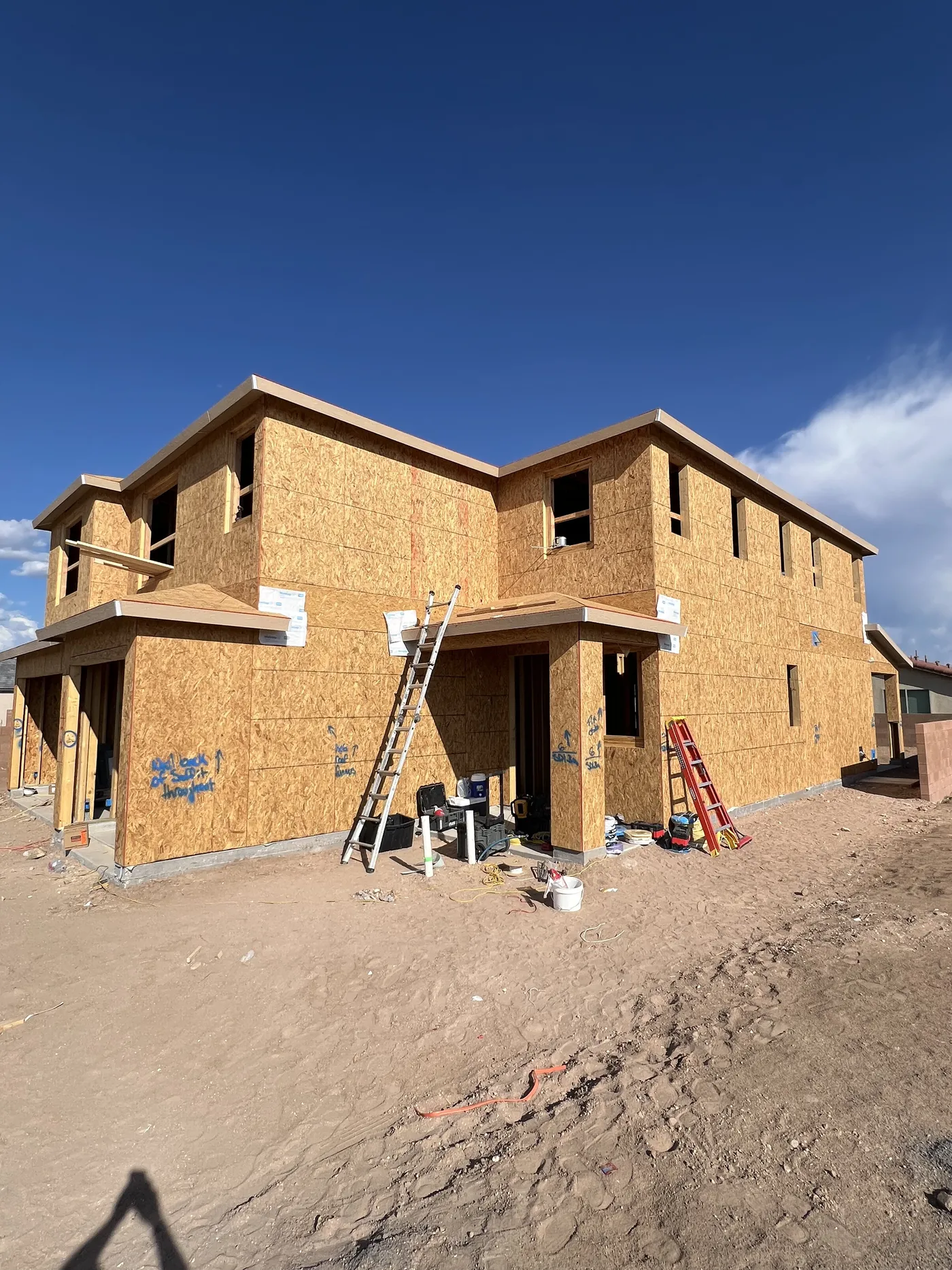 New construction framing with OSB roof sheathing before underlayment