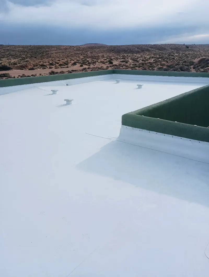 TPO membrane wrapped up and over a parapet wall corner