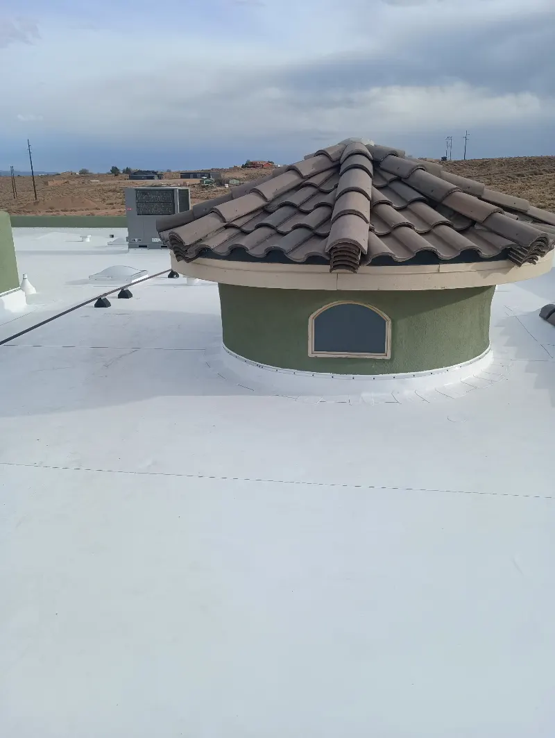 TPO flat roof sealed around a tile-roofed dome feature
