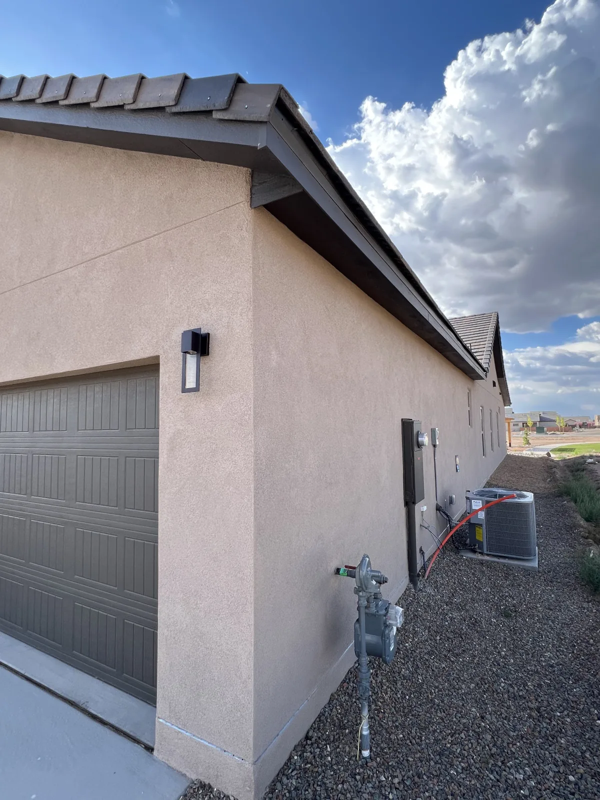 Traditional stucco home under a clear Albuquerque sky