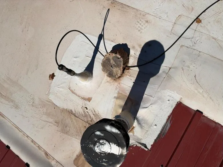 Old patches around penetrations on a flat roof
